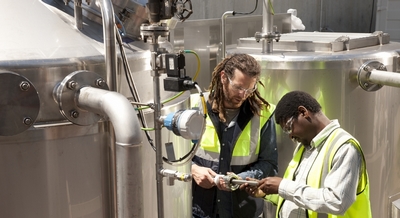 Scion pilot plant technicians George Estcourt (at left) and Anderson Aggrey provide engineering expertise to the project. 